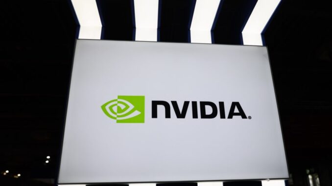 A large Nvidia logo at a conference hall