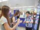 A border police officer answers questions from inbound passengers at Chongqing Jiangbei International Airport in southwest China's Chongqing, July 8, 2025.